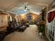 Large living room with vaulted ceilings, fireplace, and an abundance of natural light at 2671 Club Forest Se Ct, Conyers, GA 30013