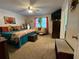 Spacious main bedroom with large bed, seating, stylish decor, and access to the attached bathroom at 2671 Club Forest Se Ct, Conyers, GA 30013