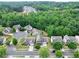 Community aerial view highlighting homes nestled in a wooded area with beautiful mature trees at 3340 Ivey Rdg, Buford, GA 30519