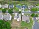 Aerial view showcases the home's location in a well-maintained neighborhood with lush greenery at 3340 Ivey Rdg, Buford, GA 30519