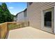 Inviting back deck perfect for relaxation and outdoor enjoyment with access to the interior at 3340 Ivey Rdg, Buford, GA 30519