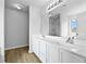 Bright bathroom with double sinks, vanity, and a large mirror at 3340 Ivey Rdg, Buford, GA 30519