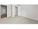 Bright bedroom with neutral carpet, open closet, and an entrance to the hallway at 3340 Ivey Rdg, Buford, GA 30519