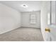 Cozy bedroom with neutral carpet, window, and a closet at 3340 Ivey Rdg, Buford, GA 30519