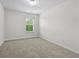 Bright bedroom with neutral carpet and a large window at 3340 Ivey Rdg, Buford, GA 30519