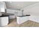 Updated kitchen featuring white cabinets, stainless steel appliances, and dark granite countertops at 3340 Ivey Rdg, Buford, GA 30519