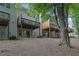 Backyard with multiple decks overlooking the ground floor with easy access to the outdoor green space at 541 Lantern Wood Dr, Scottdale, GA 30079