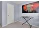 Bedroom area with keyboard, doorway, and elephant art at 541 Lantern Wood Dr, Scottdale, GA 30079