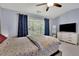 Bright bedroom with a large window and full dresser at 541 Lantern Wood Dr, Scottdale, GA 30079