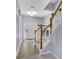 Bright entryway with gray paint, staircase, wood railing, and hardwood floors at 541 Lantern Wood Dr, Scottdale, GA 30079