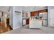 Well-lit kitchen featuring stainless steel appliances and a center island at 541 Lantern Wood Dr, Scottdale, GA 30079