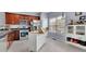 Spacious kitchen with dark cabinets, stainless steel appliances, and a white island at 541 Lantern Wood Dr, Scottdale, GA 30079