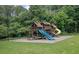 Community playground with a green slide and a yellow tube slide. Lots of fun for everyone! at 541 Lantern Wood Dr, Scottdale, GA 30079