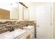 Bathroom featuring double sinks with updated vanity at 5867 Trent Walk Dr, Lithonia, GA 30038
