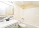 A full bath featuring a shower-tub, framed mirror, and modern sink at 5867 Trent Walk Dr, Lithonia, GA 30038