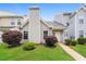 Charming townhouse with a well-maintained lawn and manicured bushes at 5867 Trent Walk Dr, Lithonia, GA 30038