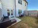 A spacious backyard with a patio, grill, and well-maintained lawn at 82 Auburn Run Ln, Auburn, GA 30011