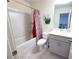 Fresh bathroom with tub, shower, and gray vanity providing functionality and style at 82 Auburn Run Ln, Auburn, GA 30011