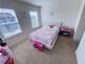 Bright bedroom with plush carpet and abundant natural light at 82 Auburn Run Ln, Auburn, GA 30011
