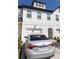 Charming townhouse with white brick and siding and attached garages at 82 Auburn Run Ln, Auburn, GA 30011