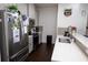 Modern kitchen featuring stainless steel appliances, gray cabinets and a breakfast bar at 82 Auburn Run Ln, Auburn, GA 30011