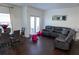 Cozy living area with comfortable seating, ample natural light, and backyard access at 82 Auburn Run Ln, Auburn, GA 30011