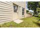 Exterior back door with sidelight and small patio at 2280 Wildwood Lake Dr, Suwanee, GA 30024