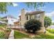 Two-story home featuring a wooden deck and lush green backyard at 2280 Wildwood Lake Dr, Suwanee, GA 30024