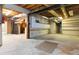 Unfinished basement featuring open ceiling, concrete floor, and utility hookups at 2280 Wildwood Lake Dr, Suwanee, GA 30024