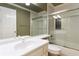 Bathroom with white cabinet, large mirror, and shower at 2280 Wildwood Lake Dr, Suwanee, GA 30024