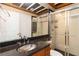 Bathroom featuring granite countertop, modern fixtures, and glass enclosed shower at 2280 Wildwood Lake Dr, Suwanee, GA 30024