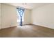 Bedroom with plush carpeting and window with decorative curtain at 2280 Wildwood Lake Dr, Suwanee, GA 30024