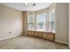 Bedroom with bay window featuring a window seat, carpeting, and neutral walls at 2280 Wildwood Lake Dr, Suwanee, GA 30024