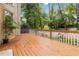 Spacious wooden deck showcases outdoor living and tranquil green surroundings at 2280 Wildwood Lake Dr, Suwanee, GA 30024