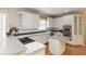 Bright kitchen with stainless steel appliances, custom cabinetry, and island at 2280 Wildwood Lake Dr, Suwanee, GA 30024