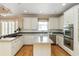 Well-equipped kitchen with stainless steel appliances and island at 2280 Wildwood Lake Dr, Suwanee, GA 30024