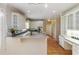 Well-lit kitchen with custom cabinets and modern appliances at 2280 Wildwood Lake Dr, Suwanee, GA 30024