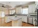Spacious kitchen featuring stainless steel appliances and a center island at 2280 Wildwood Lake Dr, Suwanee, GA 30024