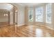 Inviting living area with hardwood floors and multiple windows offering natural light, creating a warm atmosphere at 2280 Wildwood Lake Dr, Suwanee, GA 30024
