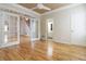 Sun-filled living room featuring hardwood floors and white trim at 2280 Wildwood Lake Dr, Suwanee, GA 30024