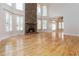 Bright living room with stone fireplace and vaulted ceilings at 2280 Wildwood Lake Dr, Suwanee, GA 30024