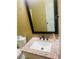 Bathroom featuring a sink, granite countertop, large mirror, and bronze fixtures at 35 Creek Bend Trl, Oxford, GA 30054
