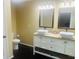 Bright bathroom features double sink vanity, framed mirrors, granite countertop, and modern fixtures at 35 Creek Bend Trl, Oxford, GA 30054