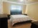 Comfortable bedroom with neutral walls, a large window, and plush carpet at 35 Creek Bend Trl, Oxford, GA 30054