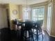 Charming dining area with a bay window and a modern chandelier at 35 Creek Bend Trl, Oxford, GA 30054