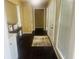 Inviting hallway featuring dark wood floors, neutral paint, and lots of natural light at 35 Creek Bend Trl, Oxford, GA 30054