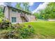 Spacious backyard featuring a well-maintained lawn, mature trees, and a convenient staircase leading to the second level at 4345 Kimball Sw Rd, Atlanta, GA 30331
