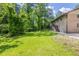 A sprawling backyard with a lush green lawn bordered by mature trees provides a private and serene outdoor space at 4345 Kimball Sw Rd, Atlanta, GA 30331