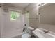 A clean bathroom with a tiled shower, vanity, and toilet at 4345 Kimball Sw Rd, Atlanta, GA 30331