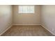 A cozy room with carpet and a window with blinds at 4345 Kimball Sw Rd, Atlanta, GA 30331